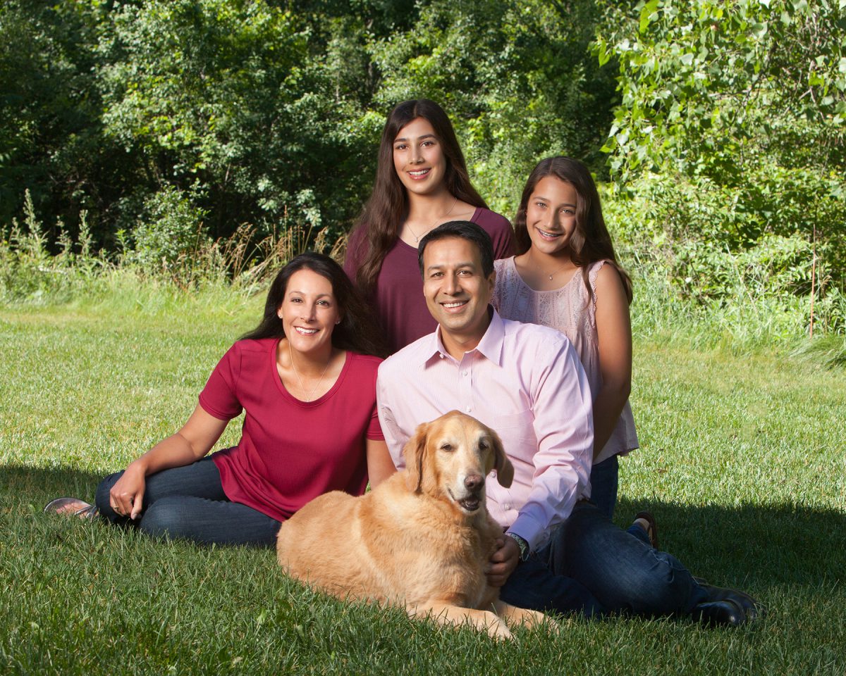 Alam with his wife, Tracy, and daughters Mayah (left) and Aliya, with their dog, Brutus.