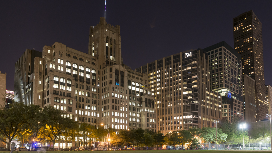 Northwestern campus exterior at night with the Ward building and Prentice Women's Hospital.