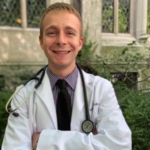 Man wearing white coat and stethoscope