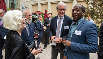 From left to right: Lynn and Dave Kelso talk with Robert Murphy, MD, and Adam Murphy, MD, ’10 GME, at the cocktail reception before dinner.