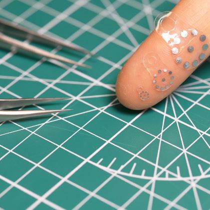 Shape-Shifting Ultrasound Stickers Detect Post-Surgical Complications